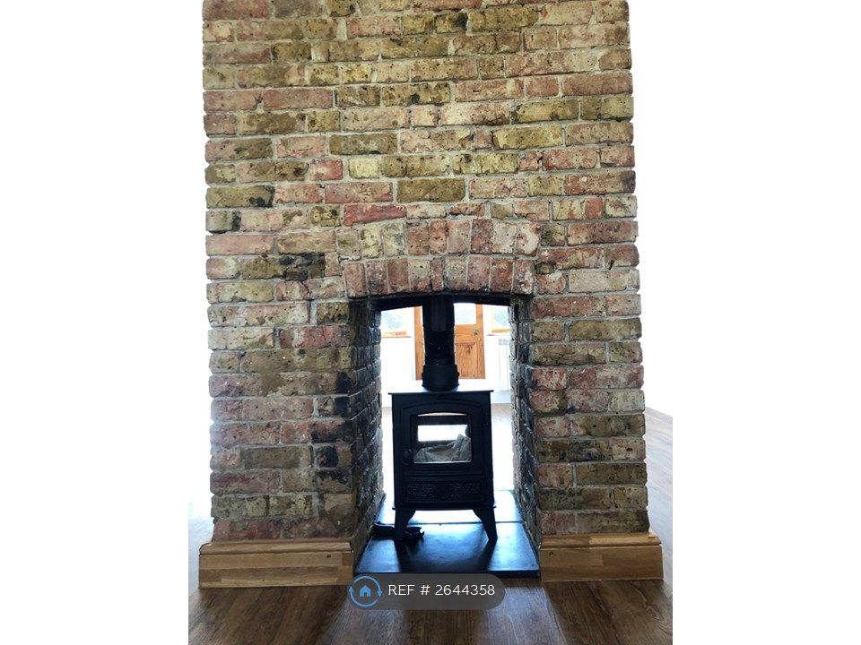 Property photo 3 of 8 Fireplace