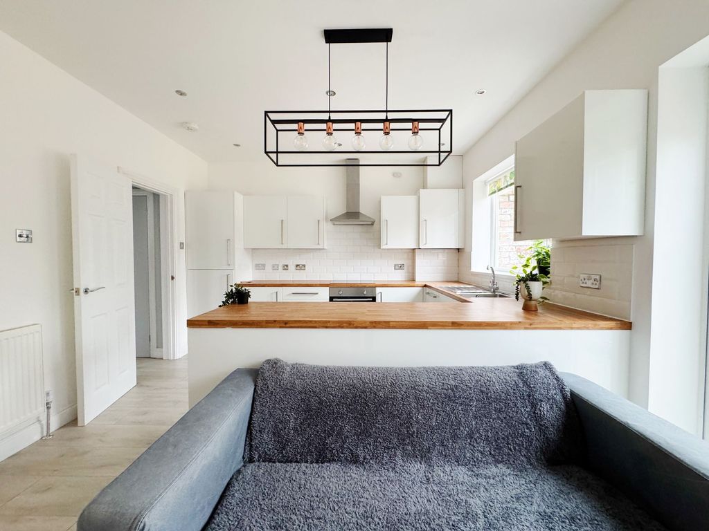 Property photo 2 of 8 Bright, Modern Open-Plan Living Area With A Cozy S...