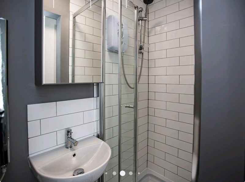 Property photo 2 of 9 Bright And Modern Bathroom Featuring A Clean White...