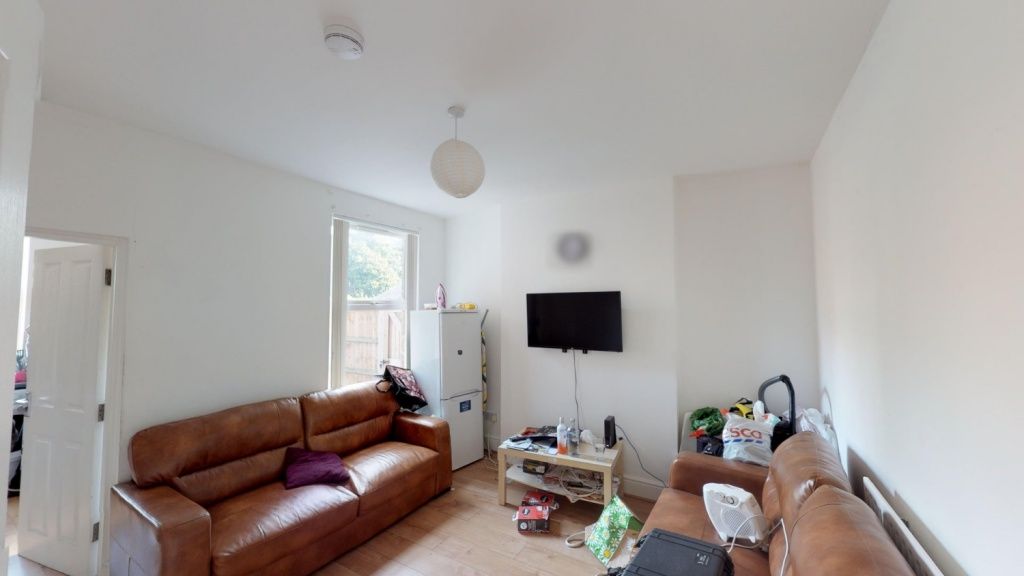Property photo 2 of 10 Cozy Living Room Featuring Comfortable Brown Leath...