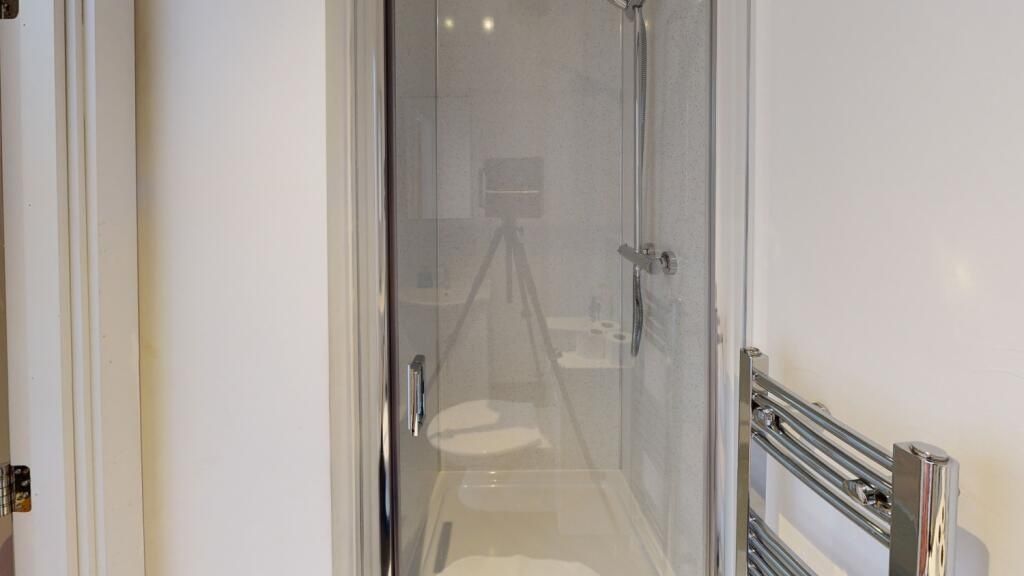 Property photo 2 of 6 A Modern Bathroom Suite Featuring A Clear Glass Sh...