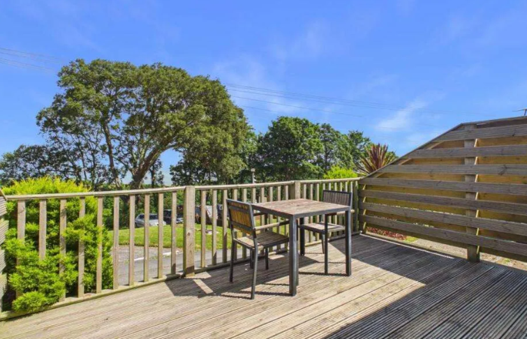 Property photo 2 of 9 Private Decking Area With Outdoor Seating And Partial Sea Views