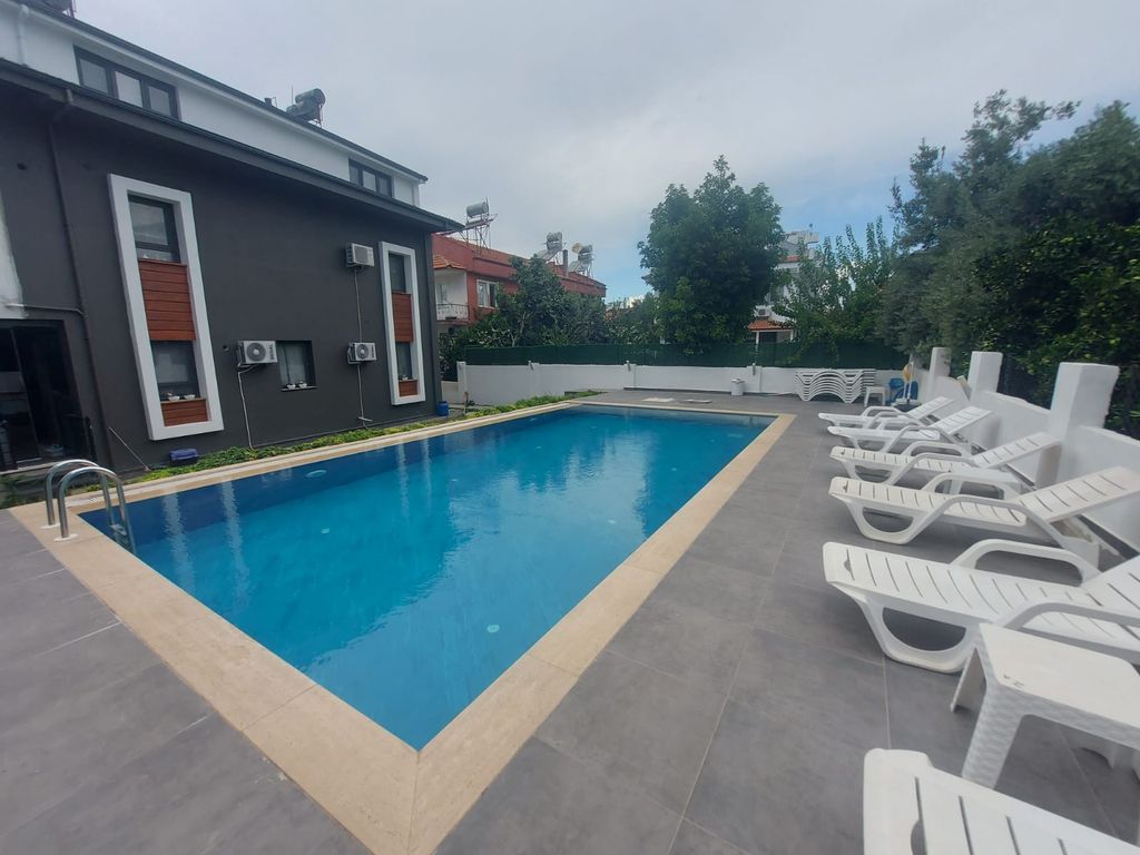 Property photo 3 of 21 Great Location Fethiye Apartment For Sale - Communal Swimming Pool With Sun Terrace