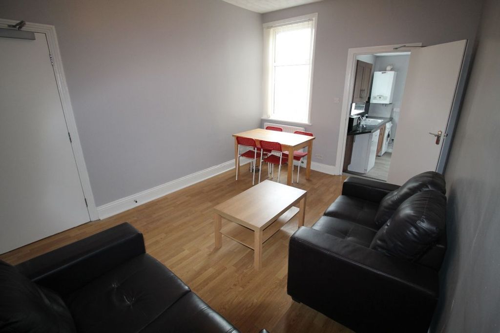 Property photo 3 of 14 Bright And Inviting Living Room Featuring Comforta...