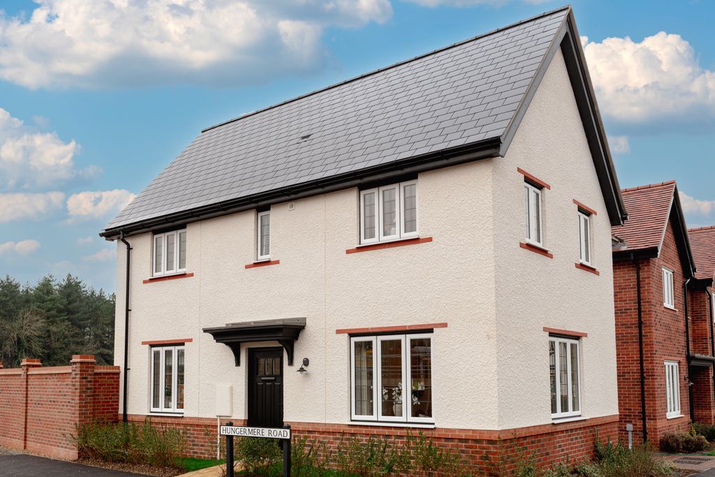 Property photo 1 of 10 A White Two-Story House With A Grey Roof And Brick Accents Stands Before A Backdrop Of A Blue Sky Wi
