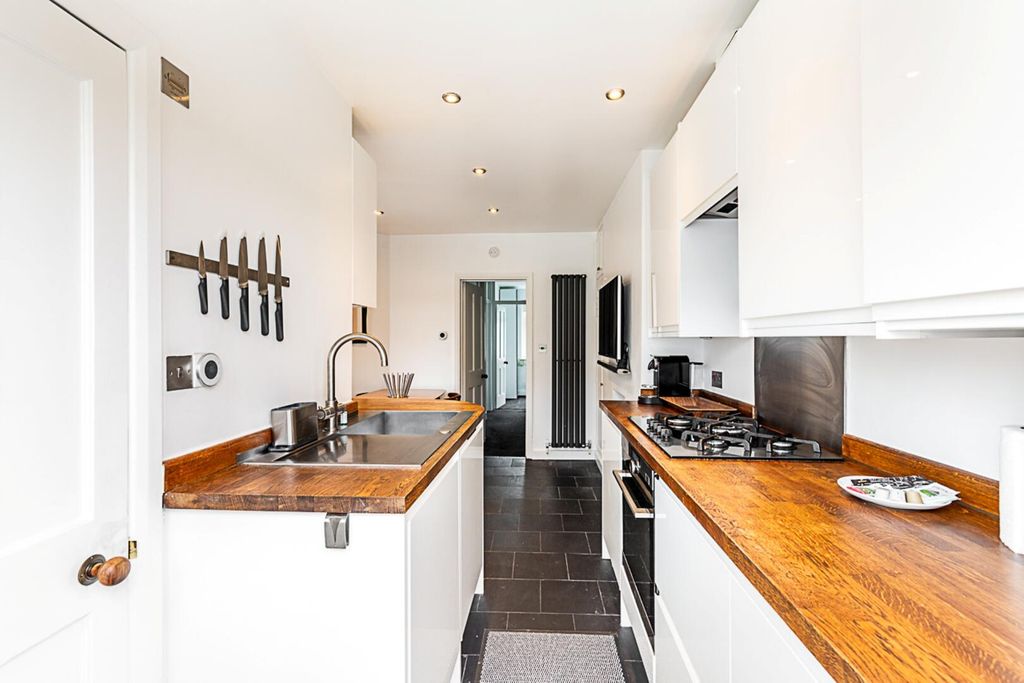Property photo 2 of 15 Byja - 16 Kimble Road Sw19 2As-18.Jpg