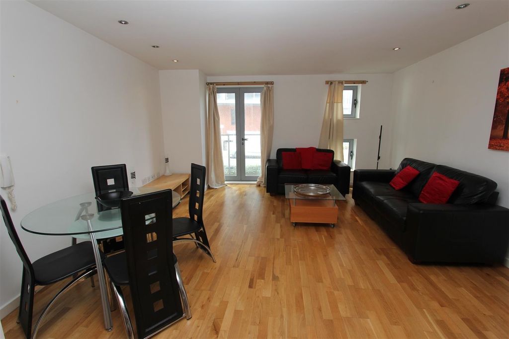 Property photo 2 of 9 Bright Open-Plan Lounge With Wood Flooring...