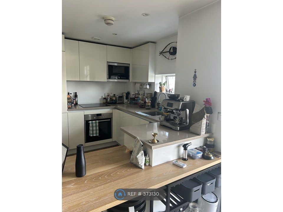 Property photo 2 of 12 Kitchen Area + Dining
