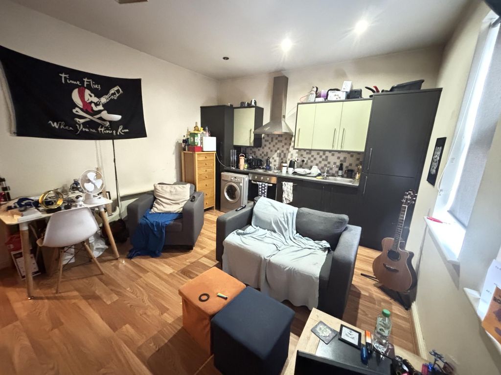 Property photo 2 of 6 A Bright And Welcoming Living Room Featuring Comfo...