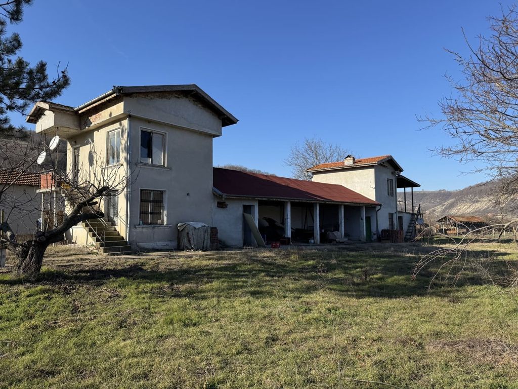 Property photo 1 of 49 View Of A Two-Storey Rural House With An Attached Single-Storey Section And A Grassy Yard With Leafless Trees.