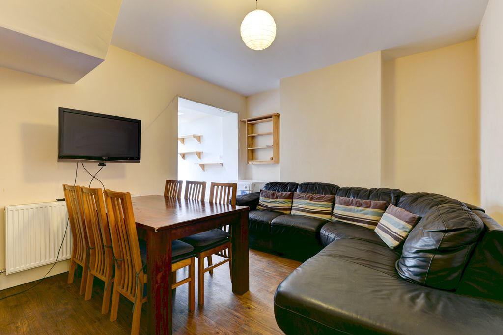 Property photo 2 of 14 A Spacious And Well-Lit Living Room Featuring A La...