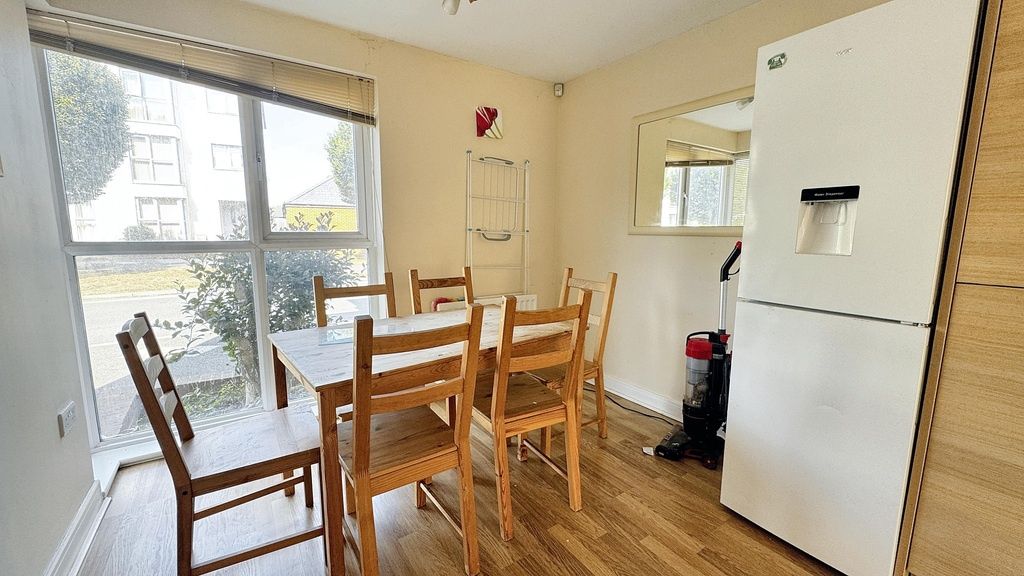 Property photo 1 of 8 A Bright, Tidy Living Room Featuring Large Windows...