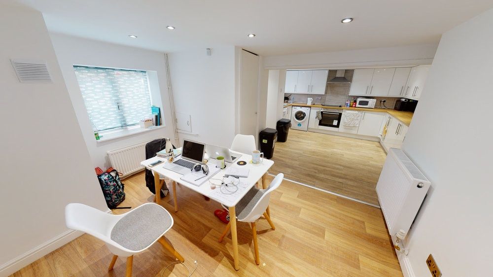 Property photo 1 of 8 A Bright And Welcoming Living Room Featuring Moder...