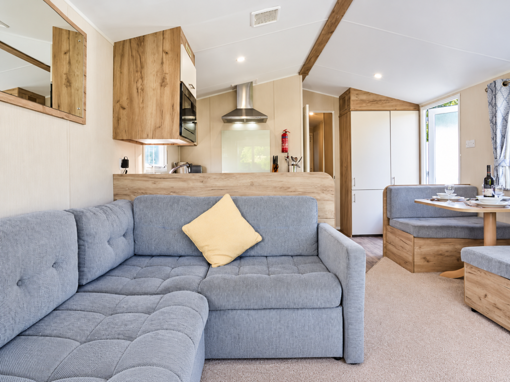 Property photo 3 of 6 Bright Open Plan Lounge With Grey L Shaped Sofa And Modern Kitchen