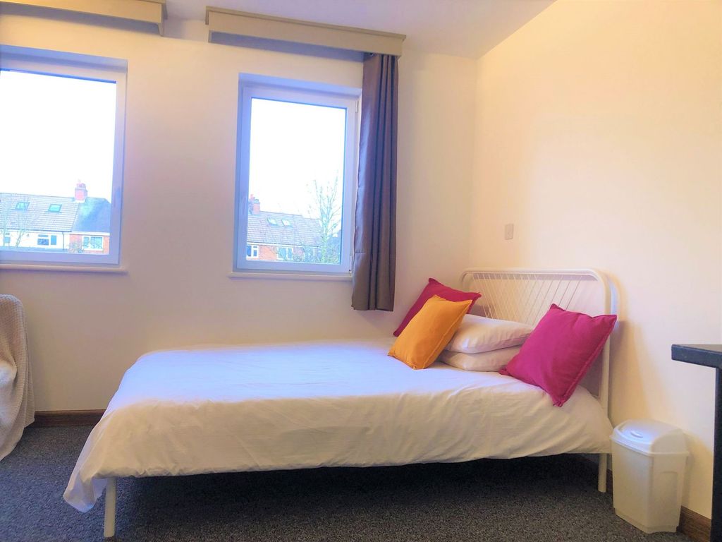 Property photo 1 of 6 A Cozy Single Bedroom With A Neatly Made Bed Adorn...