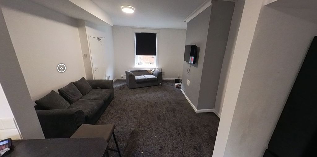 Property photo 3 of 5 A Contemporary And Well-Lit Living Room Featuring ...