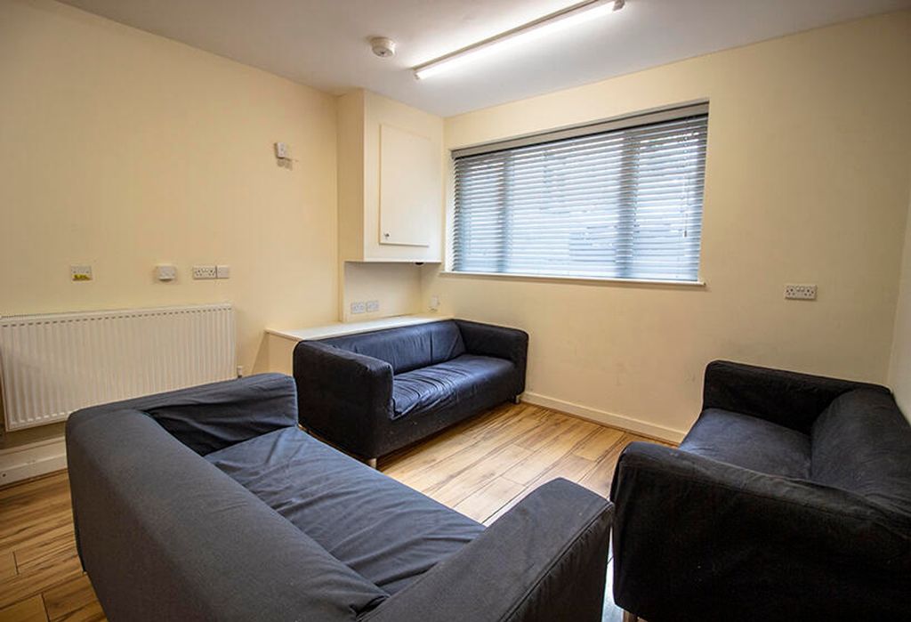 Property photo 1 of 3 Bright And Inviting Living Room Featuring Modern F...