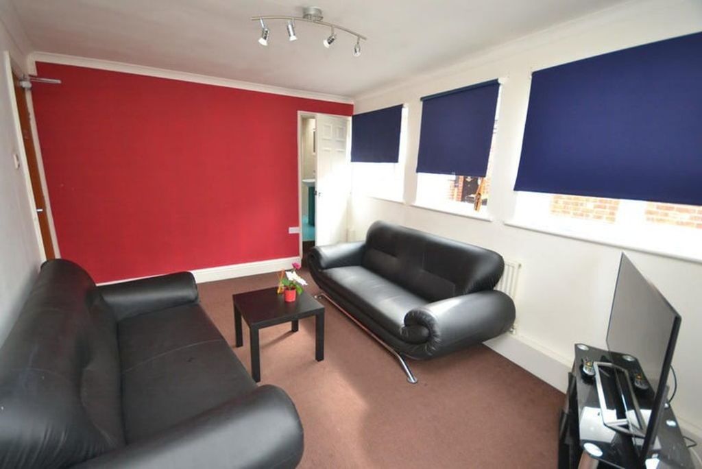 Property photo 2 of 9 A Contemporary Living Room Featuring Stylish Black...