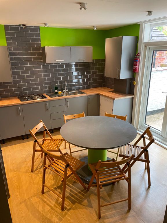 Property photo 1 of 4 Modern Kitchen Featuring Sleek Cabinetry And A Spa...