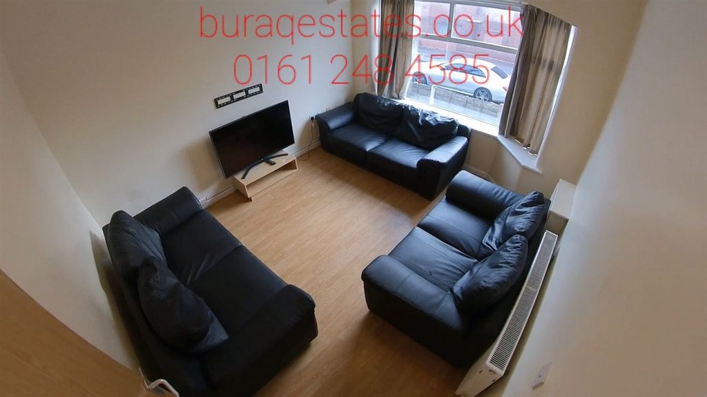 Property photo 3 of 13 Bright And Cozy Living Room Featuring Three Comfor...