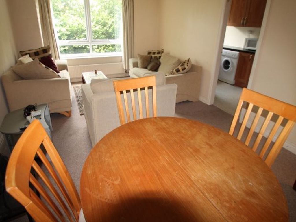 Property photo 2 of 6 A Bright And Inviting Living Room Featuring Comfor...