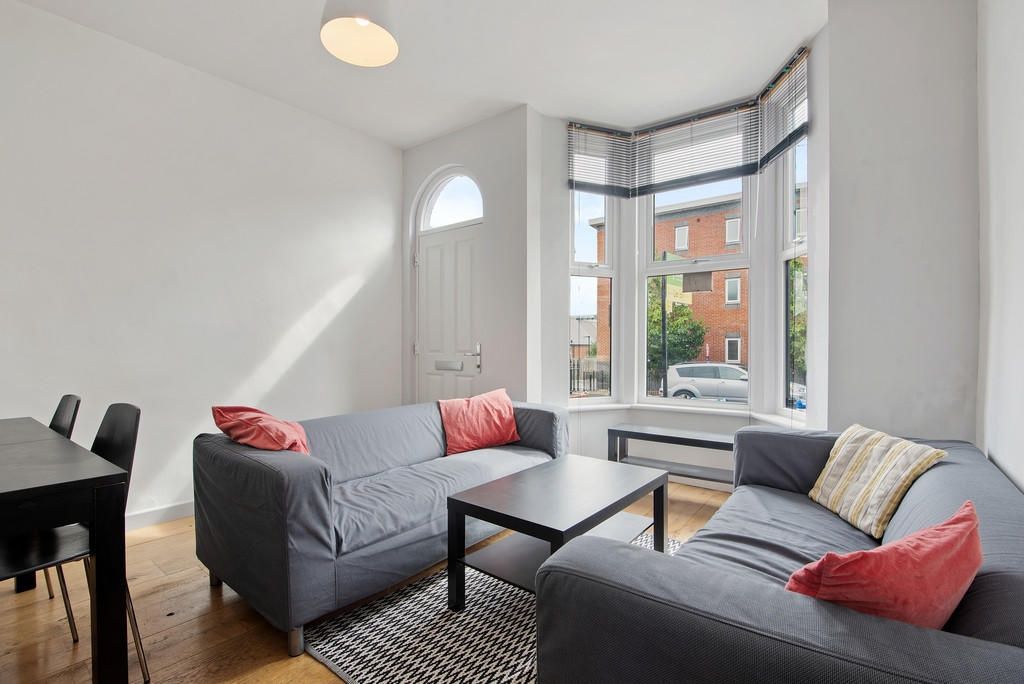 Property photo 1 of 10 Bright And Inviting Living Room Featuring Comforta...