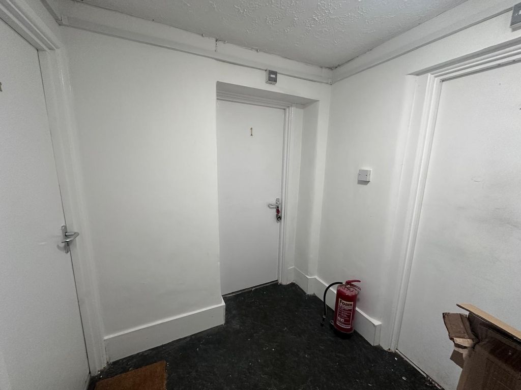 Property photo 3 of 7 Well-Maintained Internal Hallway With Clean White ...
