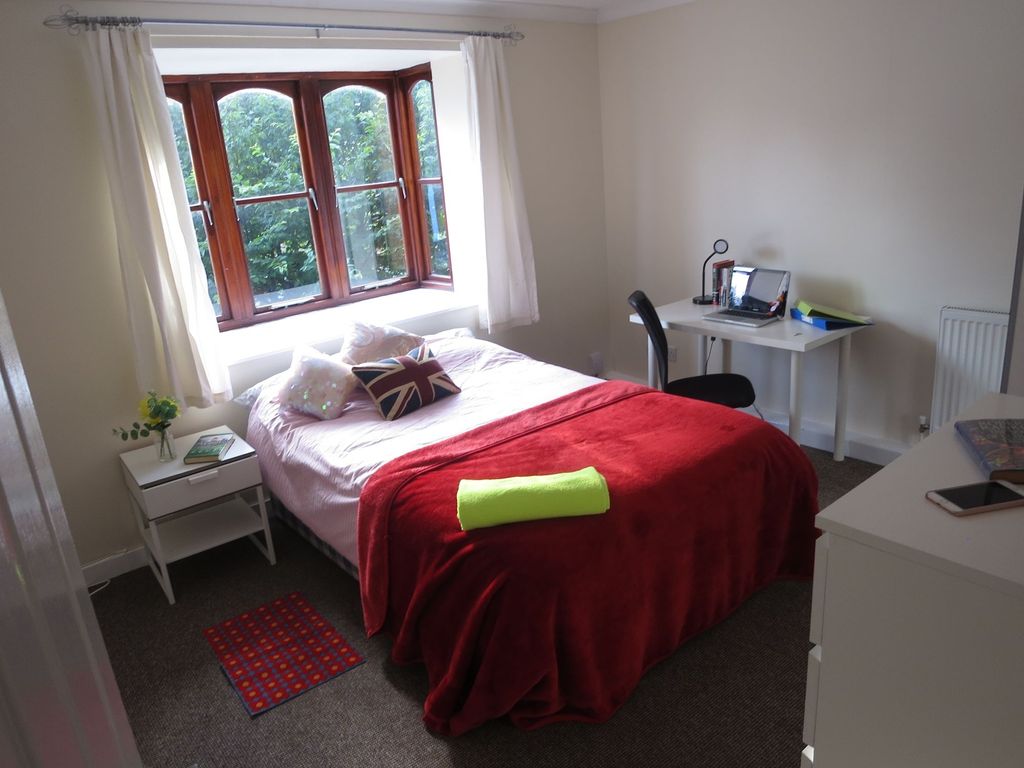 Property photo 3 of 15 Bright And Welcoming Bedroom Featuring A Large Win...
