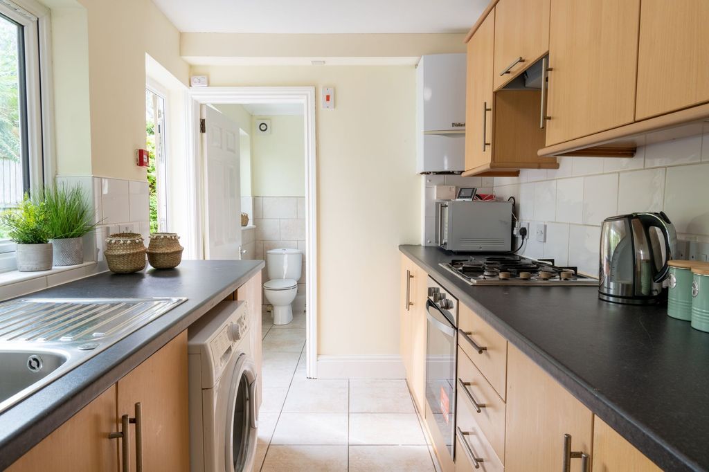 Property photo 2 of 10 Bright Modern Galley Kitchen With Light Wood Cabin...