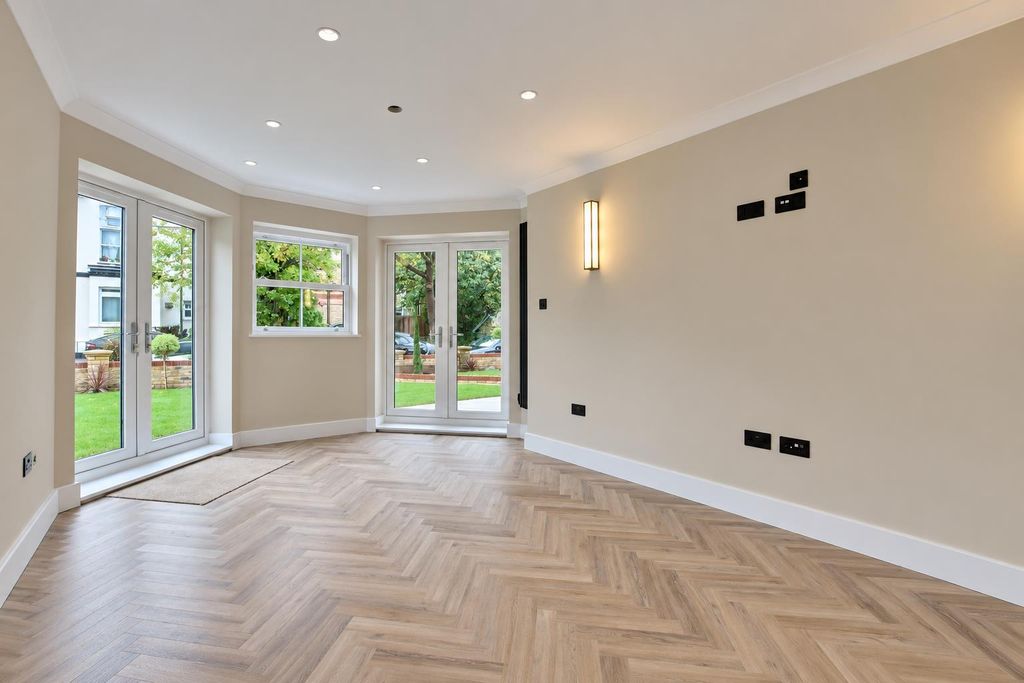 Property photo 3 of 11 Bright Modern Bay Window Living Room.Png