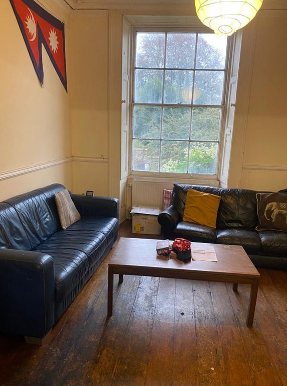 Property photo 1 of 5 A Cozy Living Room With Ample Natural Light And Co...