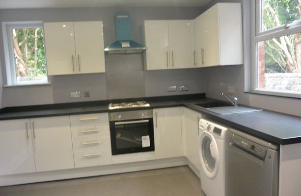 Property photo 2 of 7 Modern U-Shaped Kitchen With White Cabinets, Dark ...