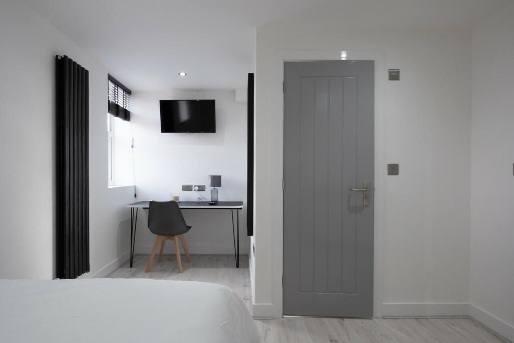 Property photo 2 of 14 A Bright And Tidy Bedroom Featuring A Clean, Minim...