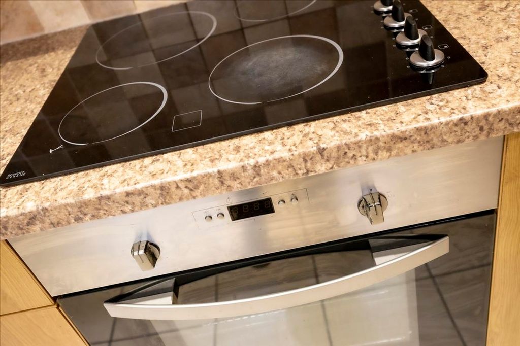 Property photo 3 of 13 A Modern Kitchen Featuring A Sleek Countertop With...