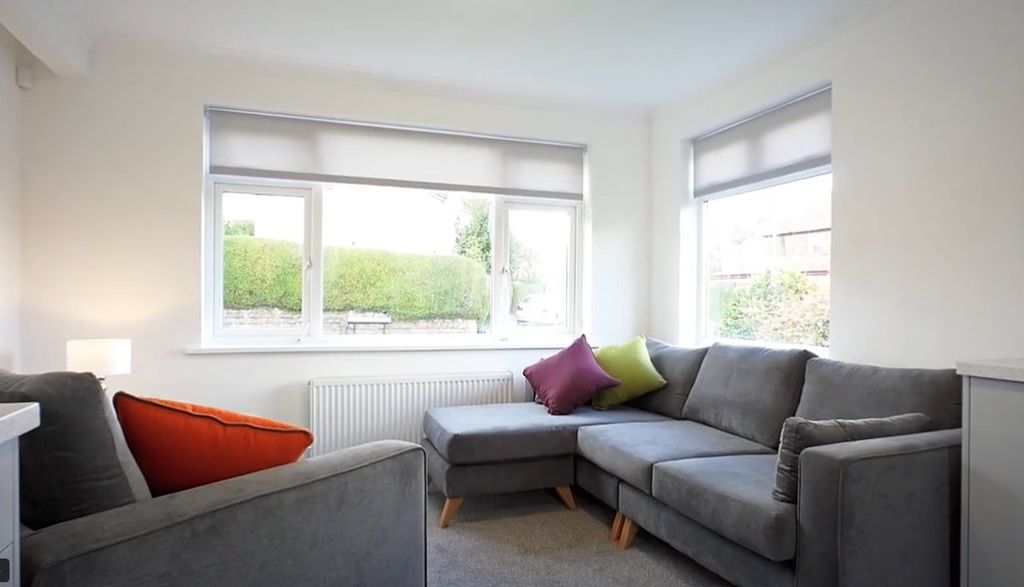 Property photo 1 of 13 A Bright And Inviting Living Room Featuring A Comf...