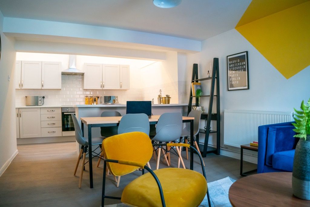 Property photo 2 of 10 A Modern, Well-Lit Living Room Featuring A mix Of ...