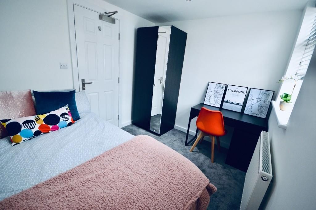 Property photo 3 of 14 Bright And Inviting Master Bedroom Featuring A Com...