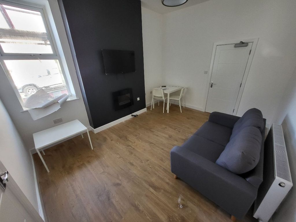 Property photo 1 of 9 A Cozy Living Room Featuring Modern Decor, Ample N...