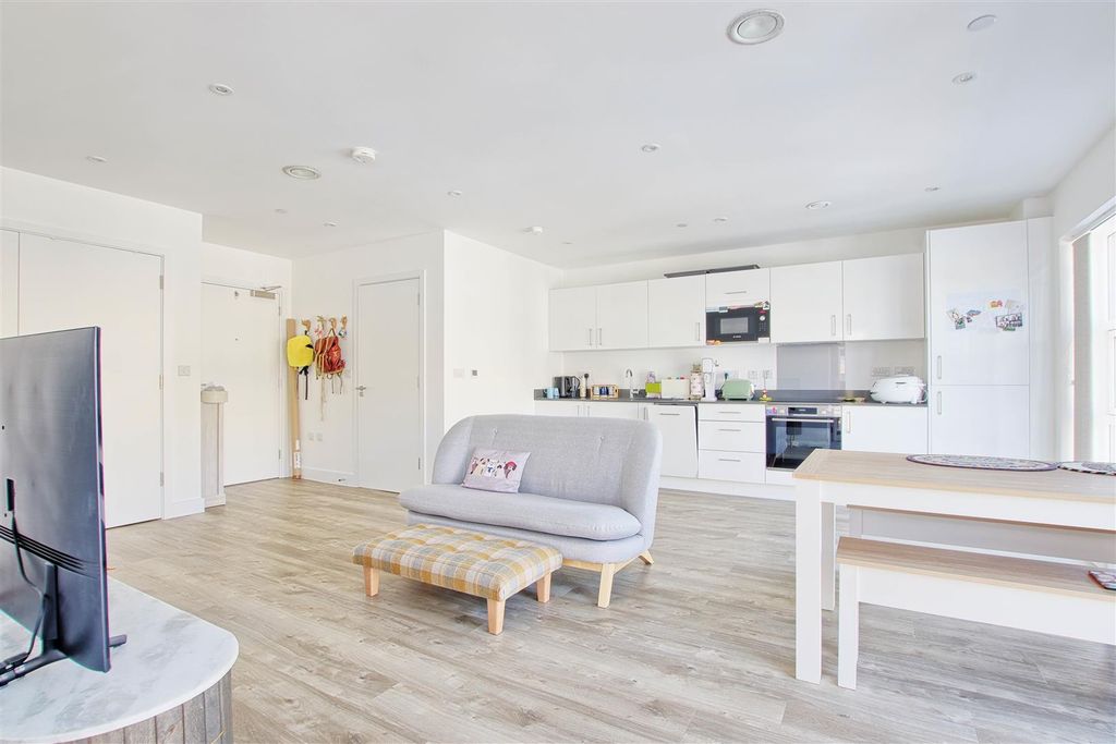 Property photo 3 of 18 Living Showing Dining.Jpg