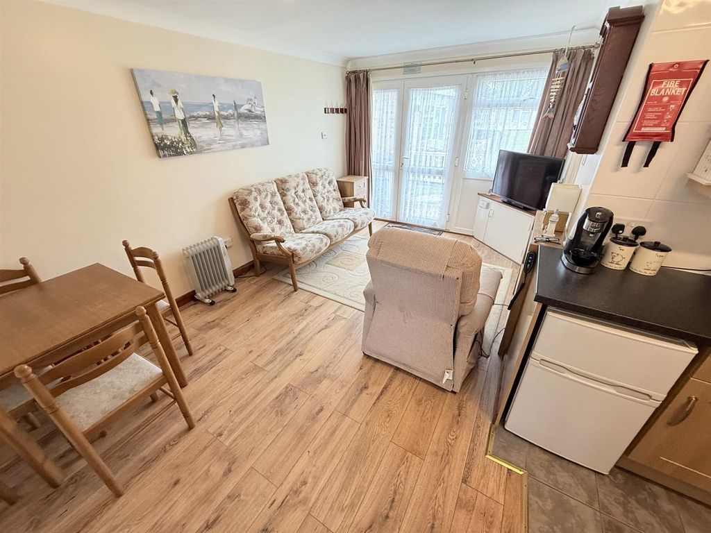 Property photo 3 of 10 Living Area And Dining Area