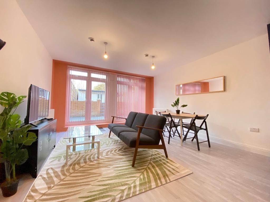 Property photo 2 of 33 Bright And Welcoming Living Room Featuring A Large...