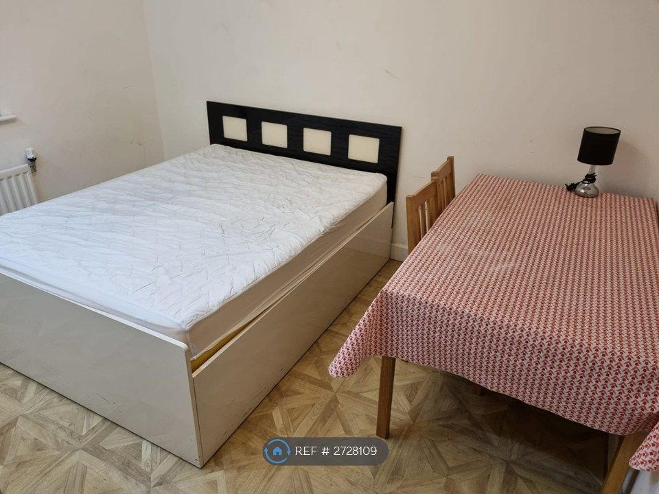 Property photo 2 of 3 King Bed & Table