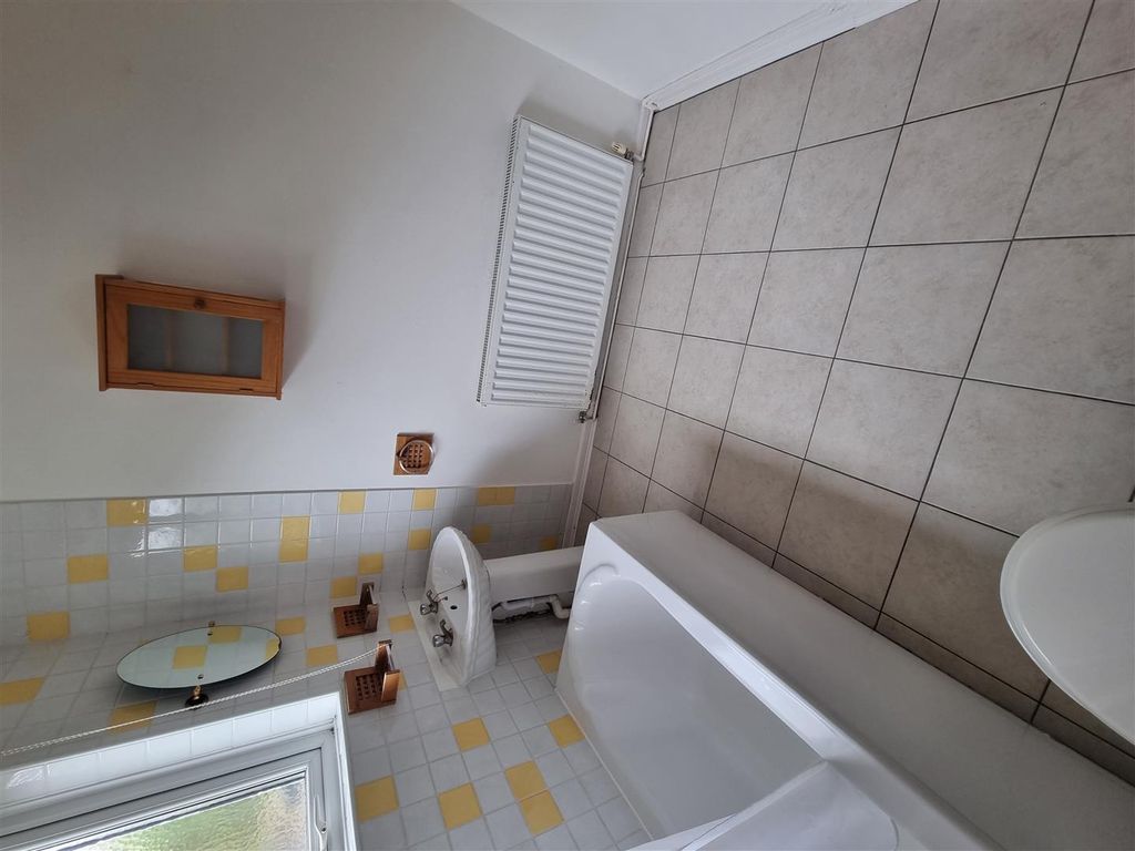 Property photo 2 of 5 Bright Bathroom With Full Tub And Tiled Floors...
