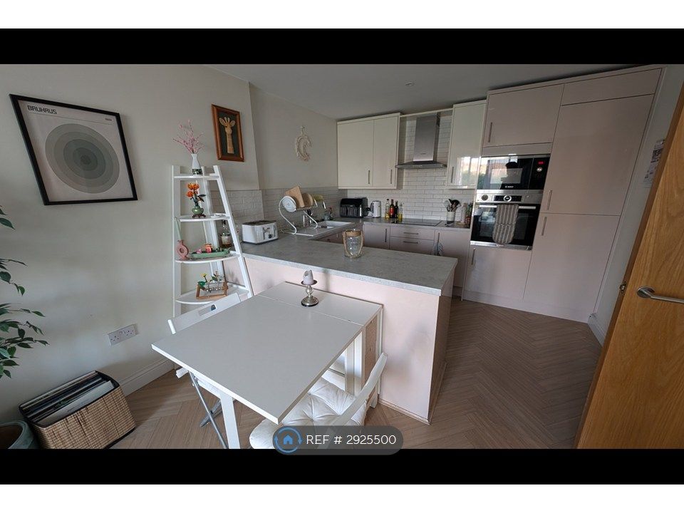 Property photo 2 of 7 Dining Area + Kitchen