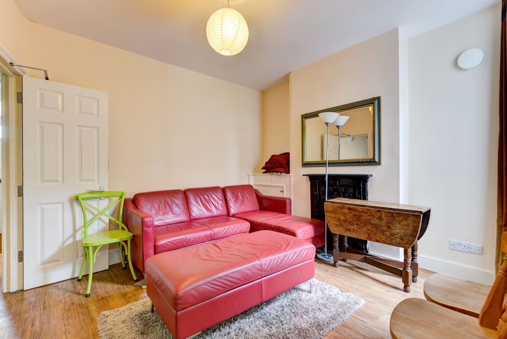 Property photo 3 of 19 Bright, Stylish Living Room With A Red Leather Cor...