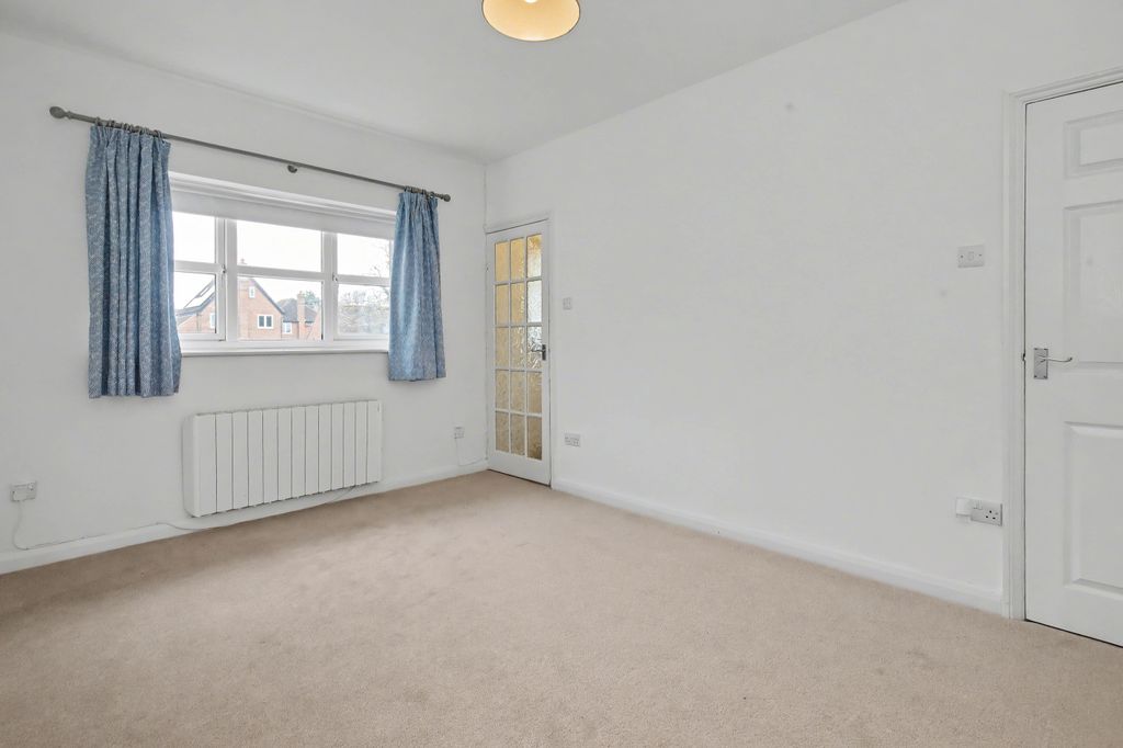 Property photo 2 of 12 Living Room - Angle 1