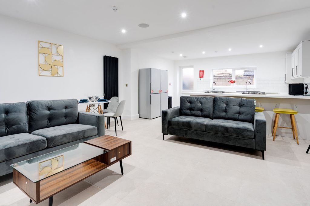 Property photo 1 of 6 A Modern And Spacious Living Area Featuring Two St...