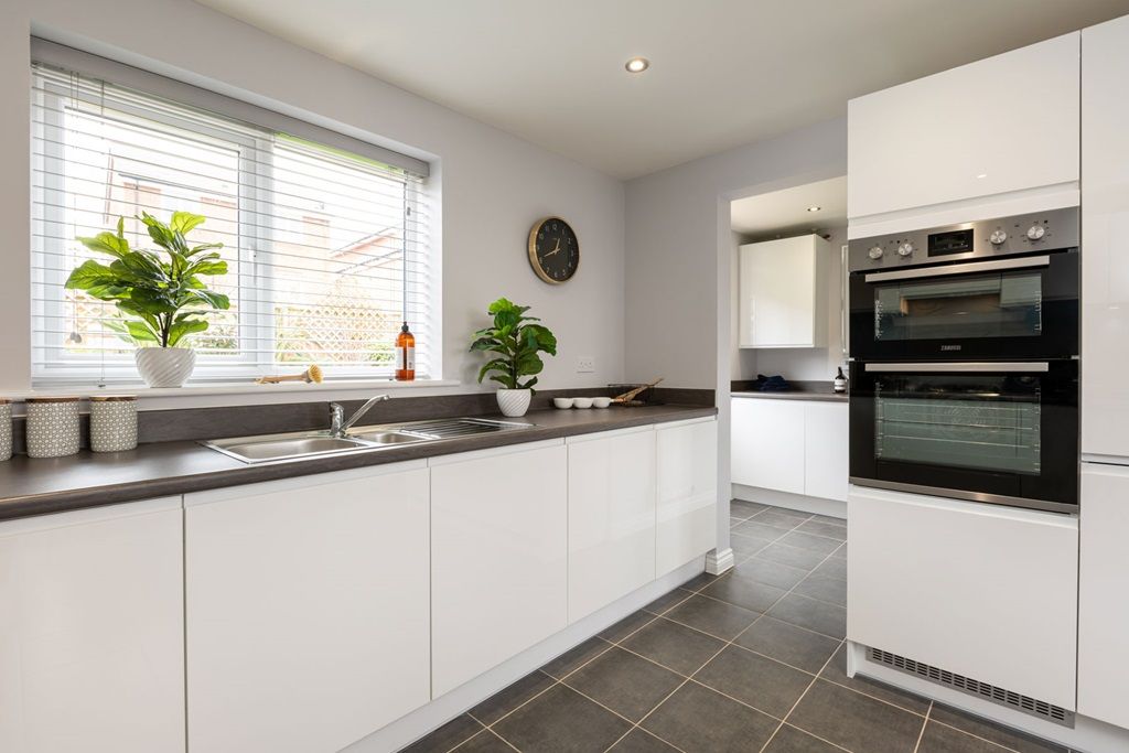 Property photo 3 of 13 Kitchen With Useful Utility For Laundry