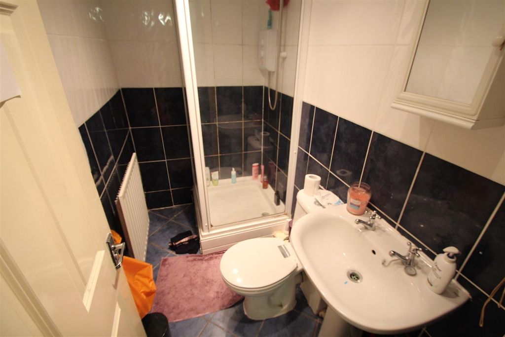 Property photo 3 of 8 A Compact Bathroom Featuring A Shower Cubicle, A T...