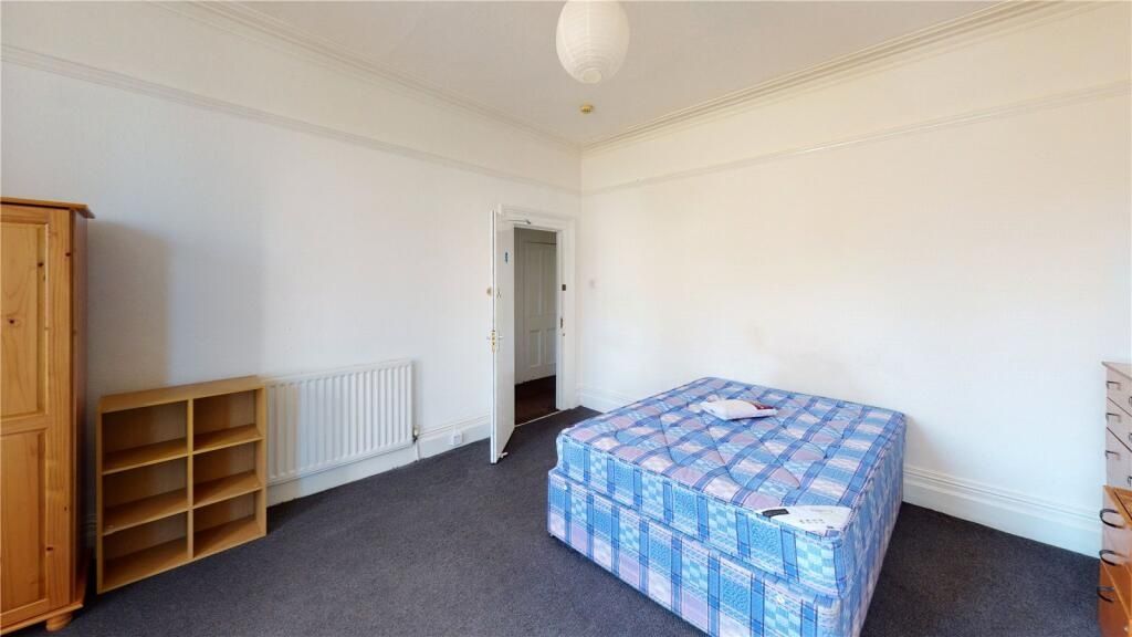 Property photo 1 of 9 A Simple And Well-Lit Bedroom Featuring A Single m...